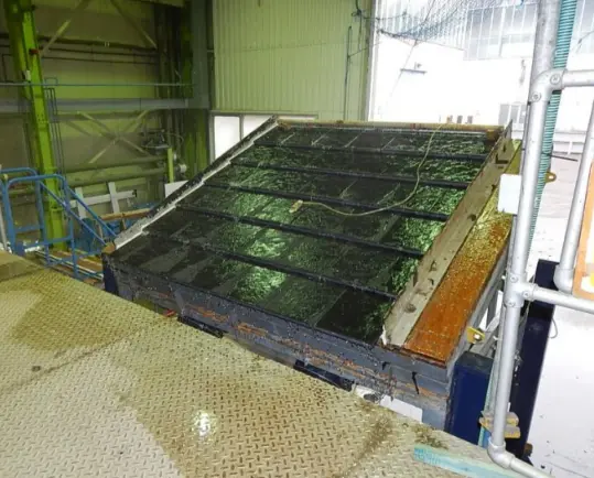 A large metal panel in a factory